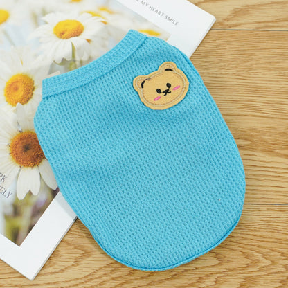 Light blue pet vest with a small bear patch detail, sleeveless design for small pets
