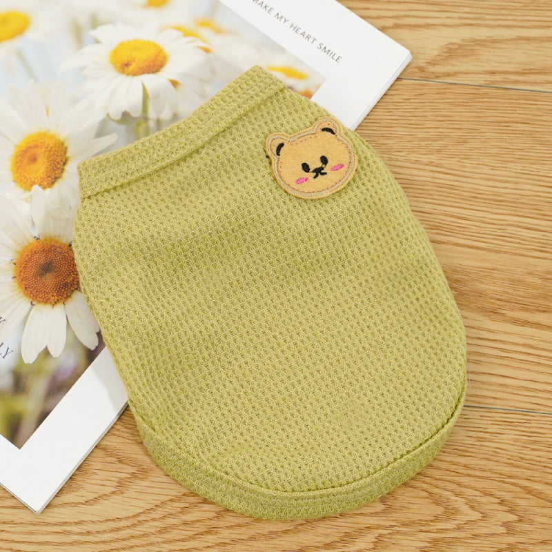 Green pet vest with a small bear patch, plain solid color pet apparel for everyday wear
