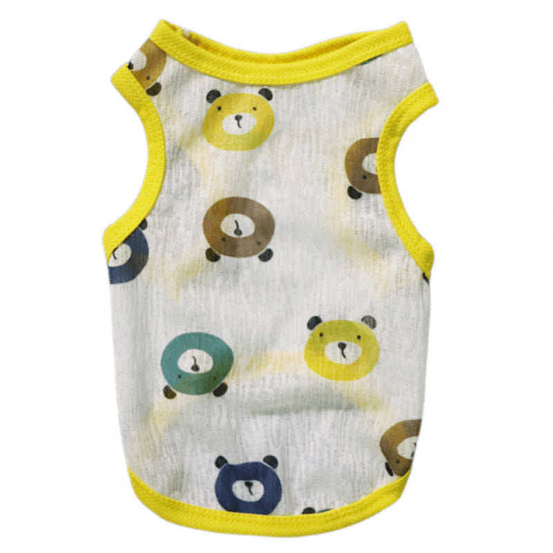 Dog wearing a vibrant yellow cooling dog vest at the beach for sun protection
